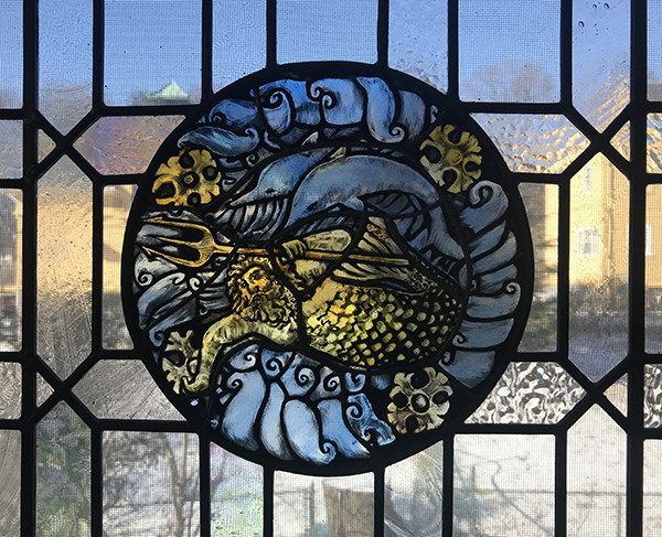 Neptune with dolphins stained glass